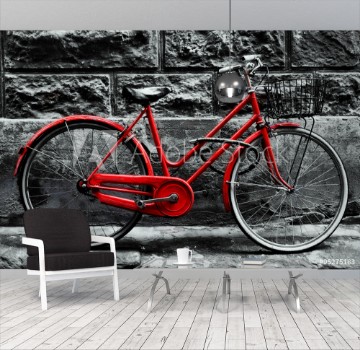 Bild på Retro vintage red bike on black and white wall